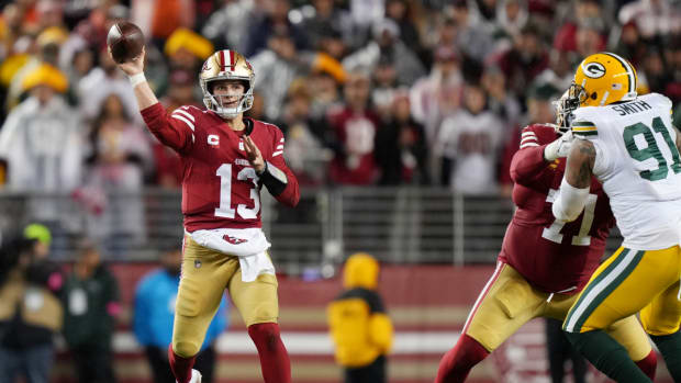 San Francisco 49ers quarterback Brock Purdy (13) throws a pass against the Green Bay Packers during the fourth quarter in a 2024 NFC divisional round game at Levi’s Stadium.